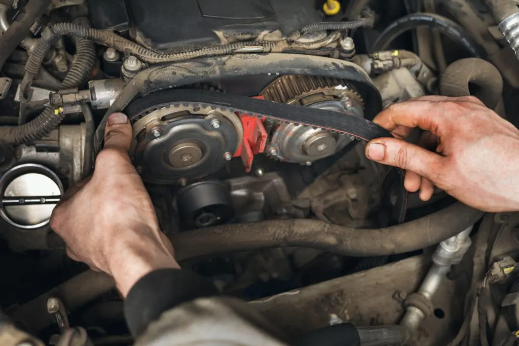 Mechanic replaces timing belt