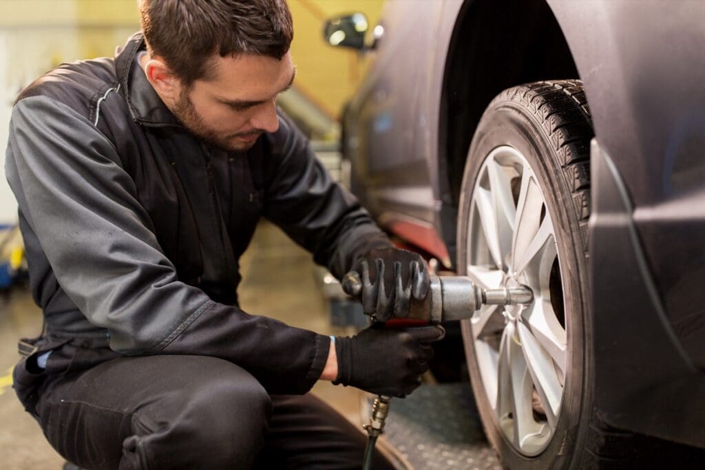 Mechanic mounting summer tires